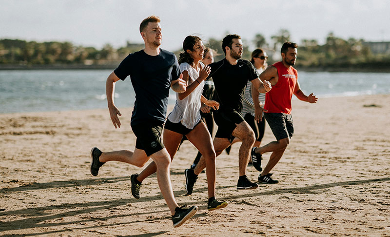 people running on beach
