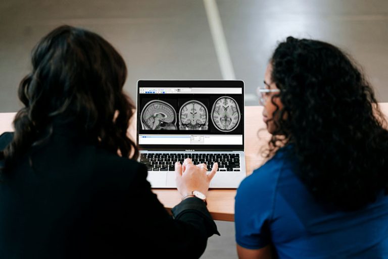 two people looking at a brain scan