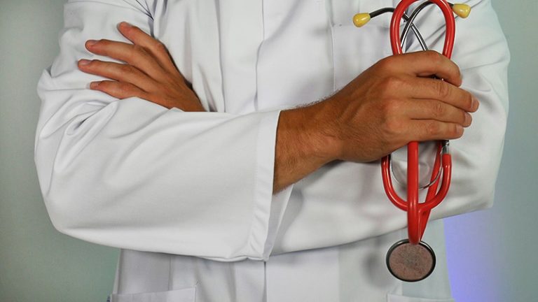 male doctor with arms crossed