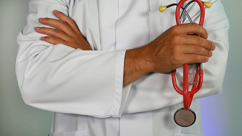 male doctor with arms crossed
